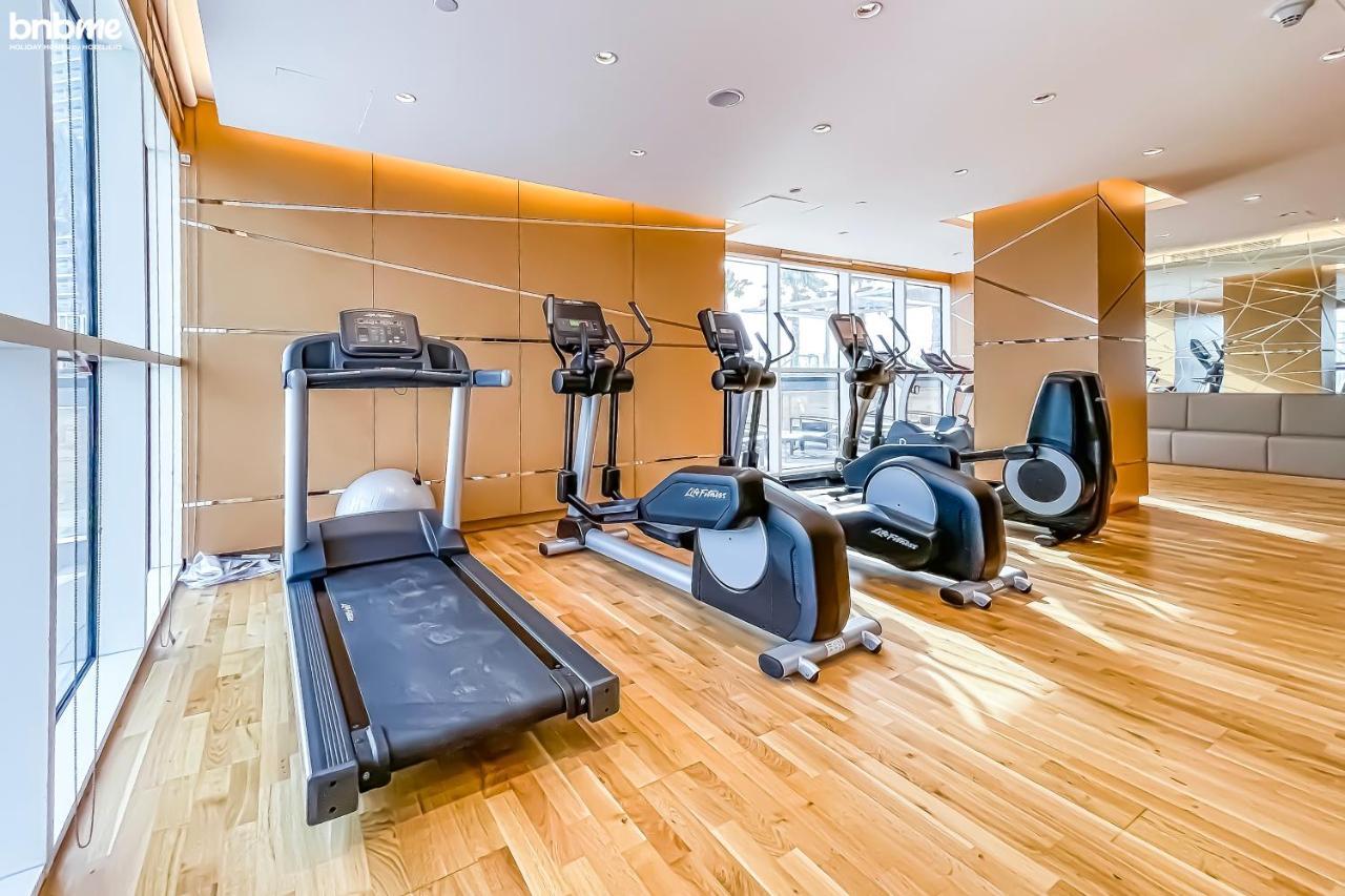 Bnbmehomes - Damac Hills - Carson Tower Apartment *