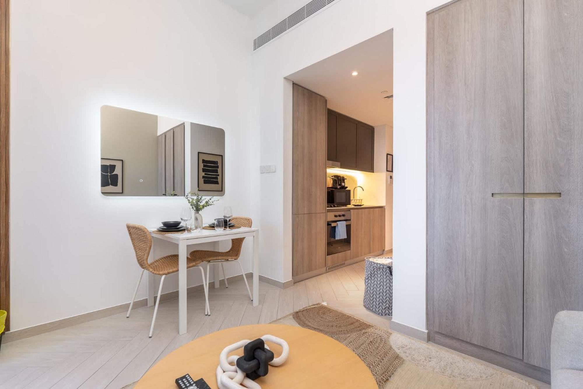 Minimalist With Nature-inspired Balcony In Jvc Apartment Dubai