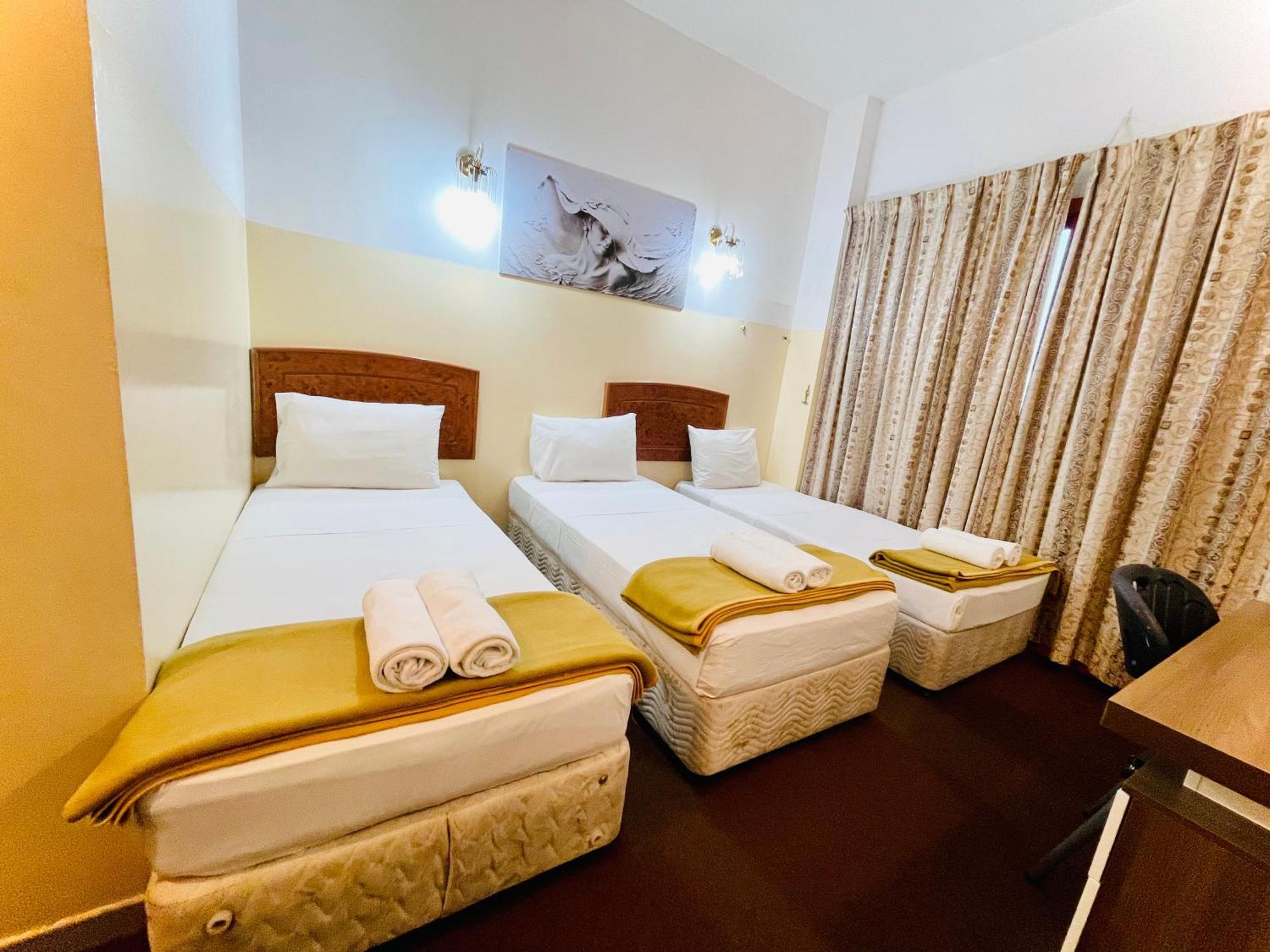 Queens Next Sabkha Bus Station Hotel